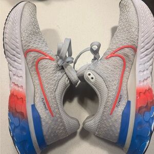 Nike Women’s Gray Sneakers with Blue and Orange Accents